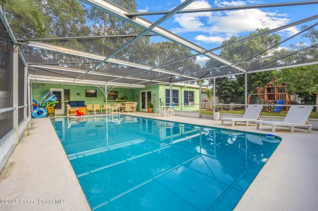 a view of a swimming pool with a patio