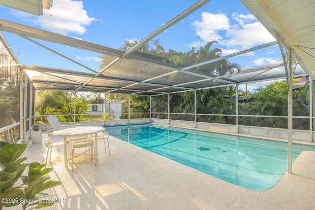 a view of a swimming pool with a patio