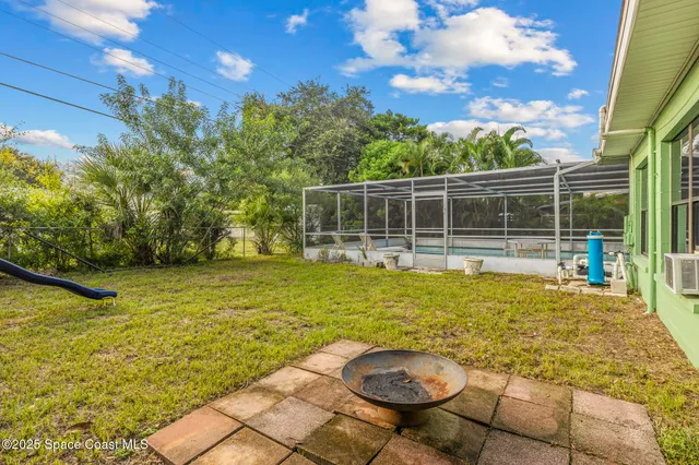 a view of a swimming pool with an outdoor seating