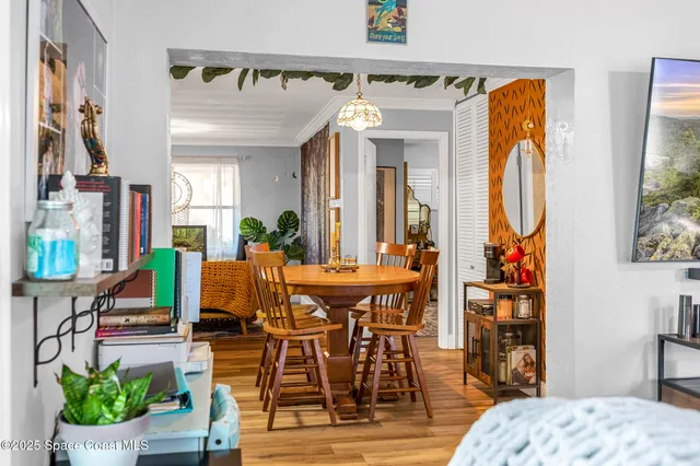 a view of a livingroom with furniture and a potted plant