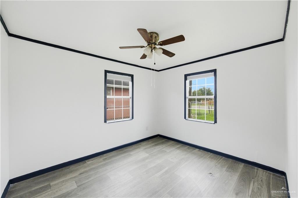 715 East Rusty Drive Pharr, TX 78577 - Photo 9 of 14 a view of an empty room with a window