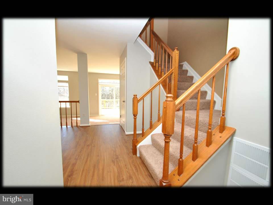 3738 Foxford Stream Road Baltimore, MD 21236 - Photo 11 of 25 STAIRCASE TO UPPER LEVEL