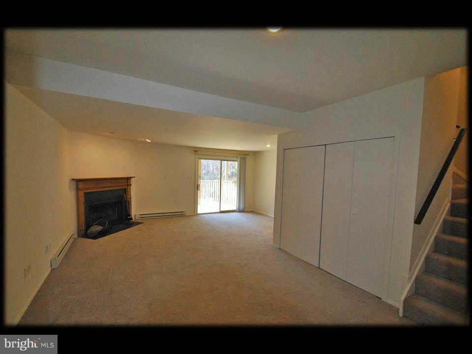 3738 Foxford Stream Road Baltimore, MD 21236 - Photo 22 of 25 FULLY FINISHED BASEMENT W/WOOD BURNING FIREPLACE