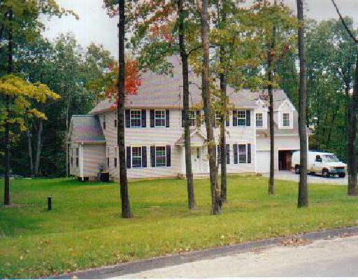 7 Stonebridge Road Oxford, CT 06478 - Photo 1 of 1 a front view of a house with a yard