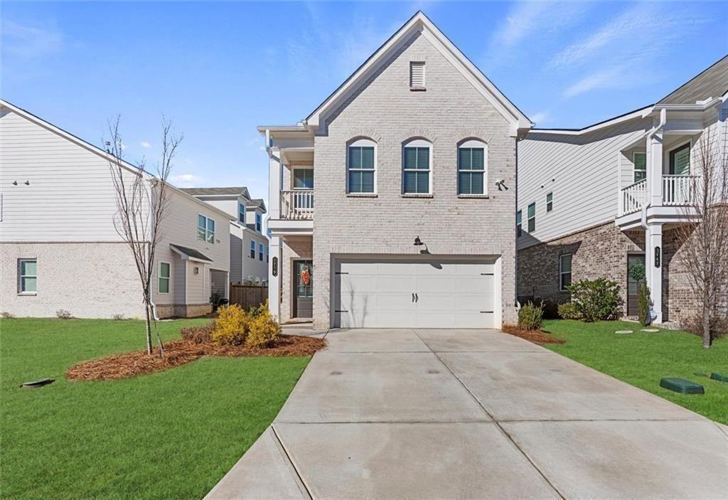 3739 Silvery Way Powder Springs, GA 30127 - Photo 1 of 28 a view of a white house next to a yard