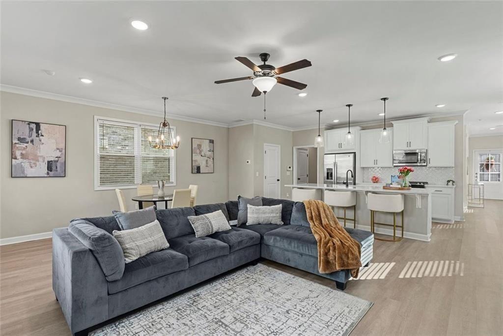 3739 Silvery Way Powder Springs, GA 30127 - Photo 11 of 28 a living room with furniture and kitchen view