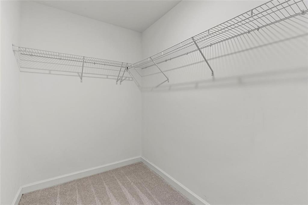 3739 Silvery Way Powder Springs, GA 30127 - Photo 19 of 28 a view of a room with racks on the wall