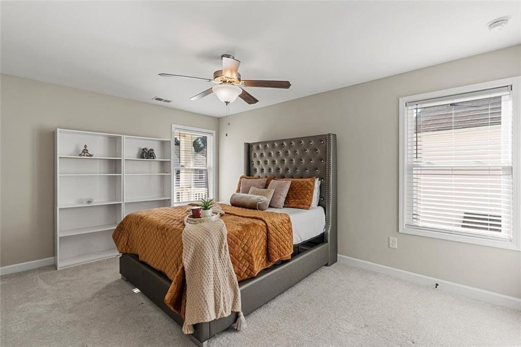 3739 Silvery Way Powder Springs, GA 30127 - Photo 20 of 28 a bedroom with a bed and a window