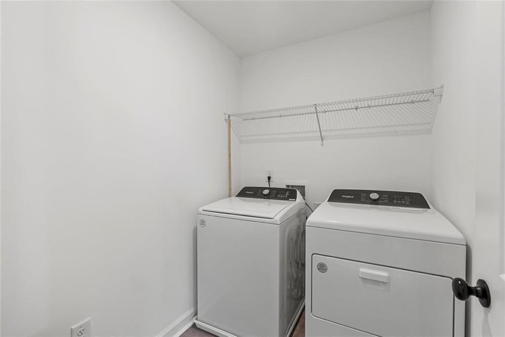 3739 Silvery Way Powder Springs, GA 30127 - Photo 22 of 28 a utility room with dryer and washer