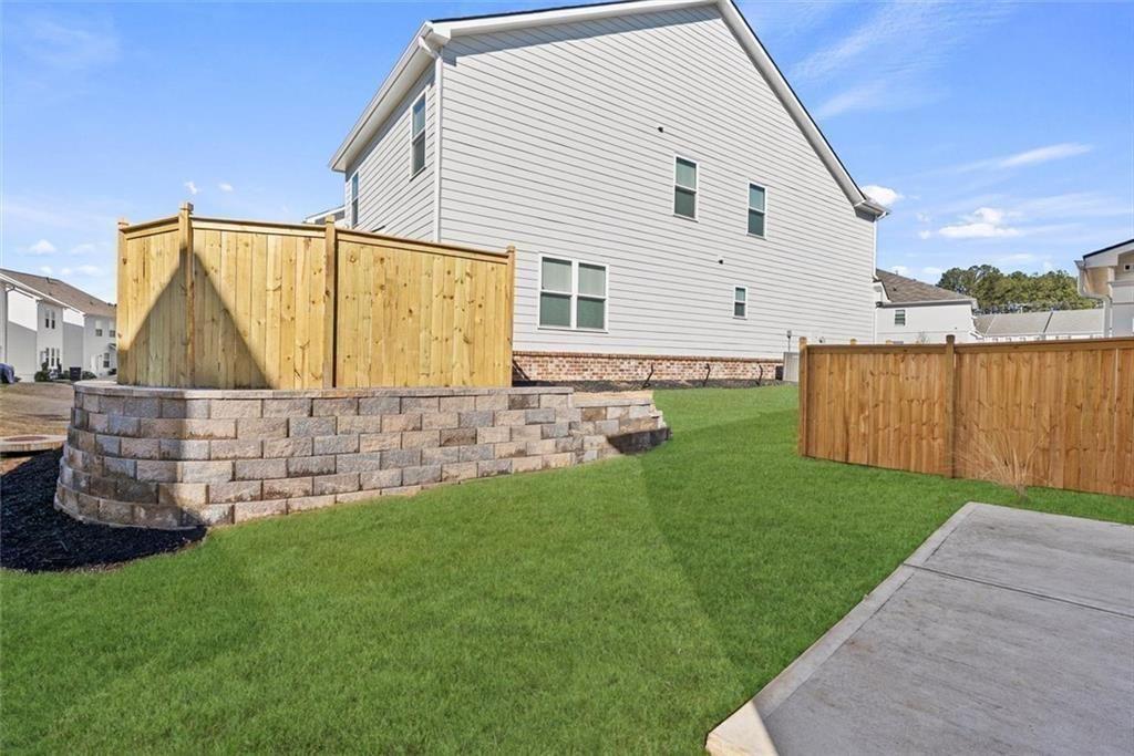 3739 Silvery Way Powder Springs, GA 30127 - Photo 24 of 28 a view of backyard with wooden fence