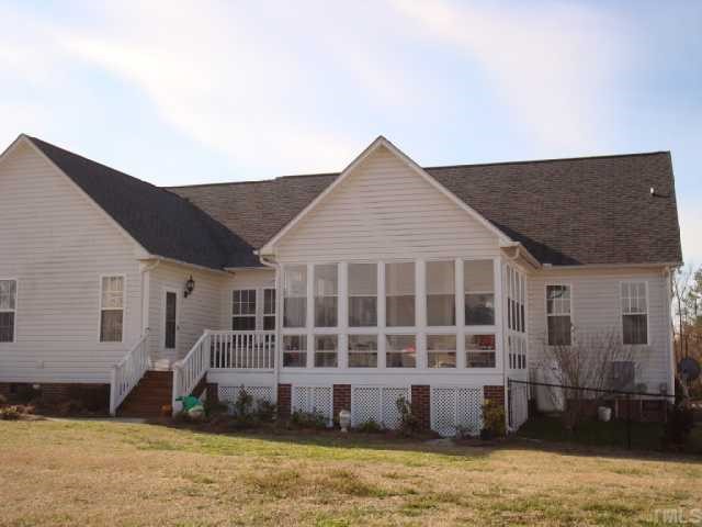 98 Line Drive Raleigh, NC 27603 - Photo 4 of 12 View showing sunroom and deck.