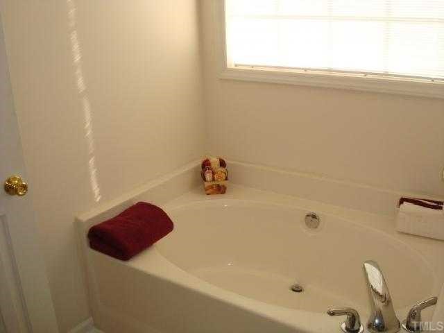 98 Line Drive Raleigh, NC 27603 - Photo 10 of 12 Garden tub. Bathroom has separate shower and double vanity.