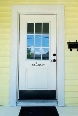 a view of potted plant in front of a door