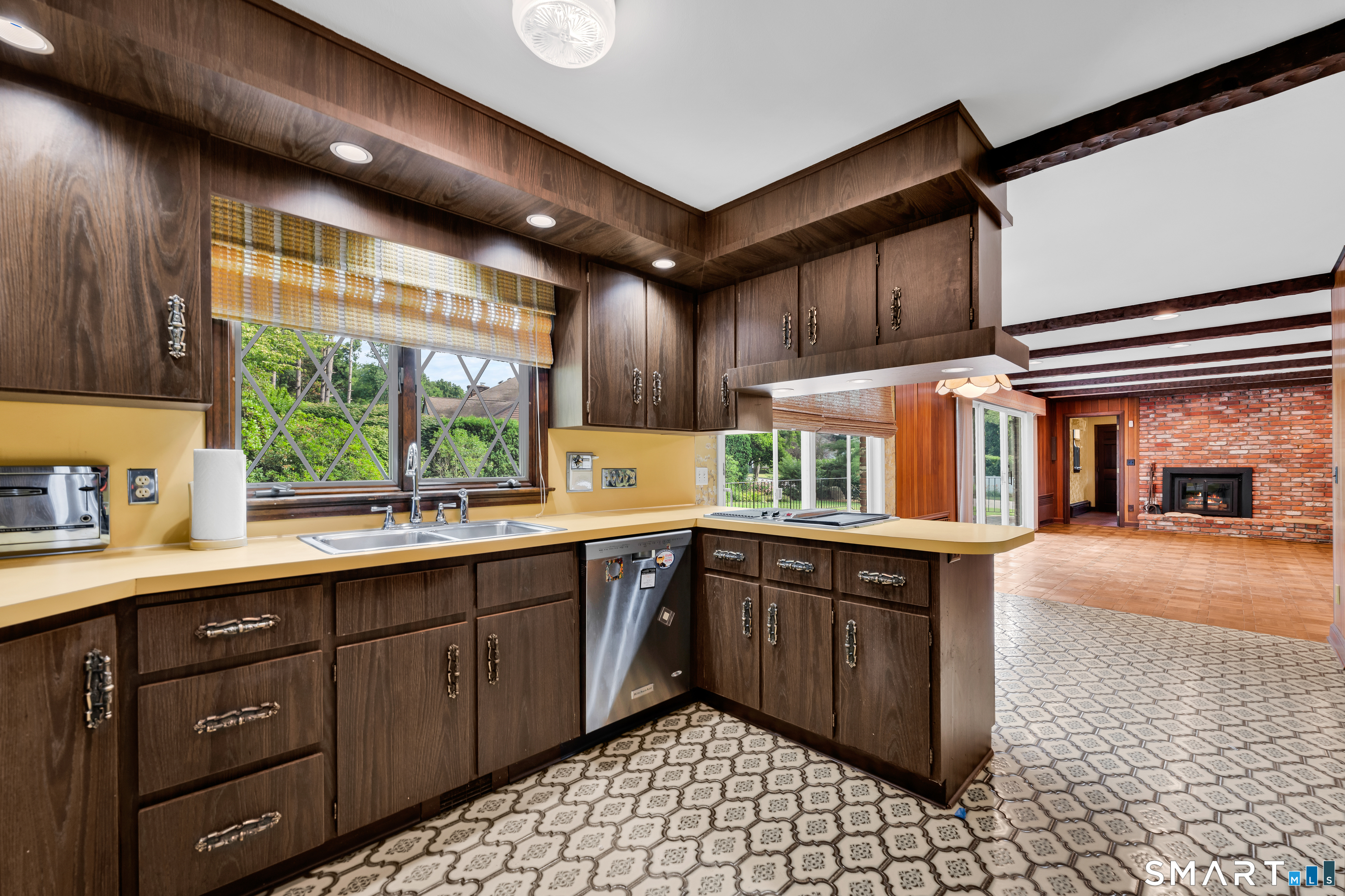 232 Maybrook Road Waterbury, CT 06708 - Photo 11 of 38 a kitchen with a sink and cabinets