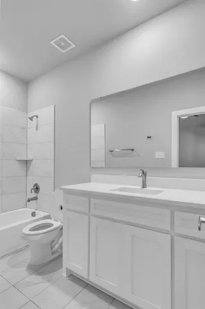a bathroom with a sink a toilet and bathtub
