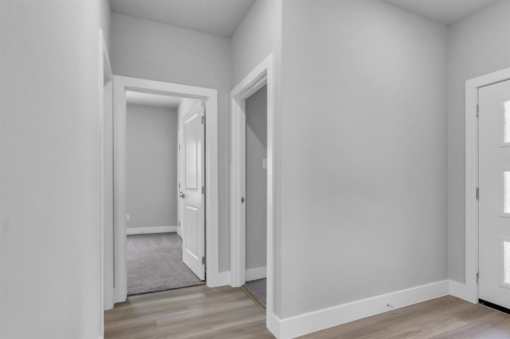 121 West Morton Street Denison, TX 75021 - Photo 20 of 28 a view of a hallway with wooden floor