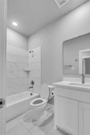 a bathroom with a sink a toilet and a bathtub
