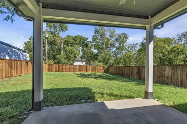 a view of a back yard from a room