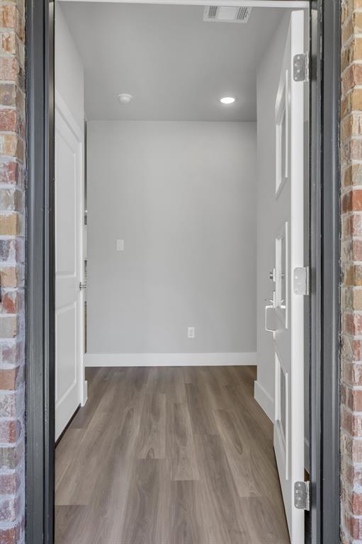 121 West Morton Street Denison, TX 75021 - Photo 5 of 28 a view of wooden floor