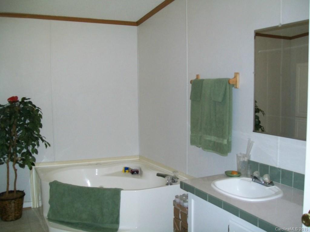 621 Sandifer Road York, SC 29745 - Photo 14 of 22 a bathroom with a sink and a mirror