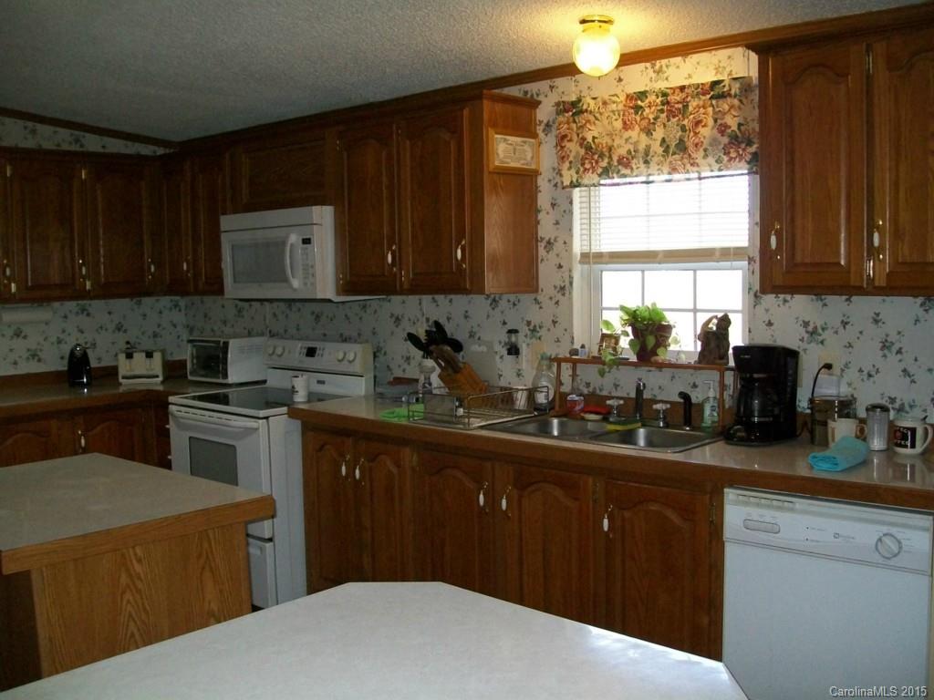 621 Sandifer Road York, SC 29745 - Photo 16 of 22 a kitchen with a sink a stove and cabinets