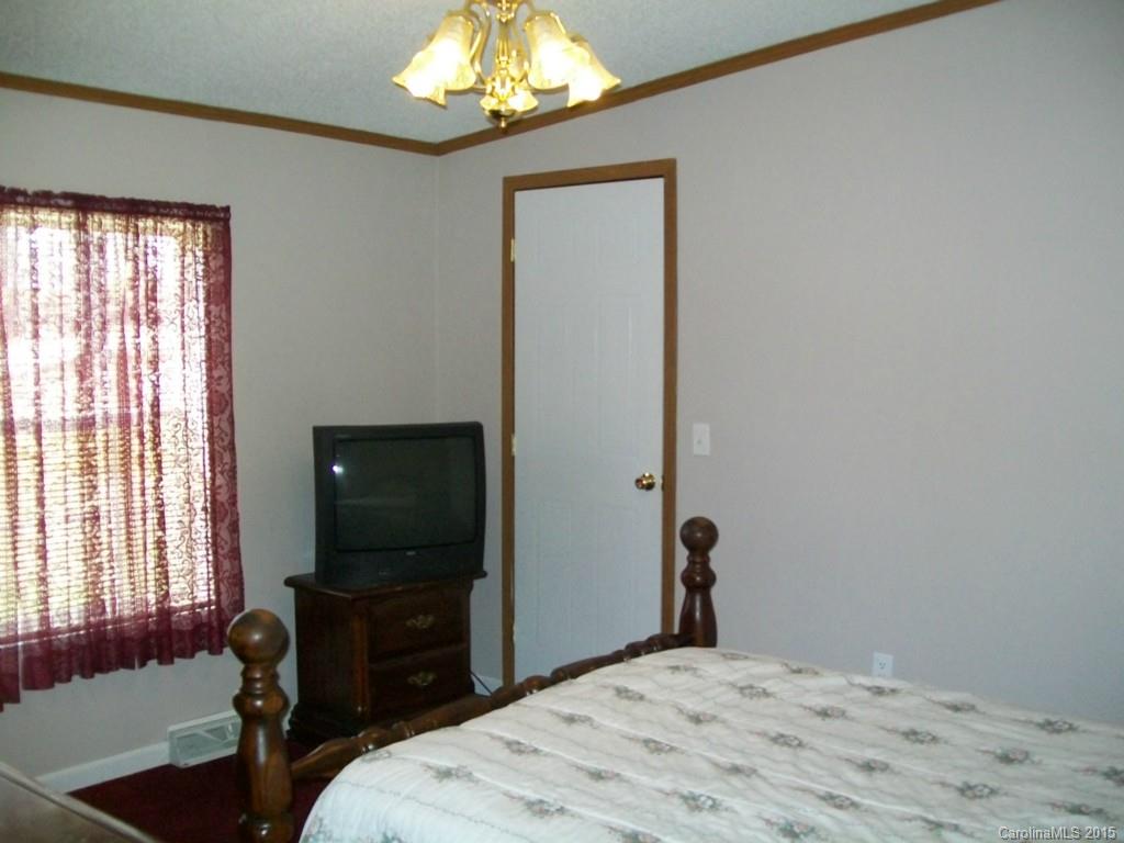 621 Sandifer Road York, SC 29745 - Photo 18 of 22 a bedroom with a bed and a flat screen tv