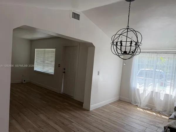 a view of entryway with wooden floor