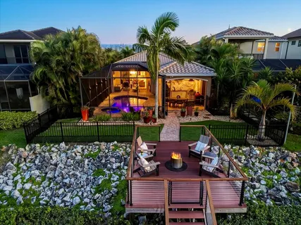 a view of a chairs and table in a backyard