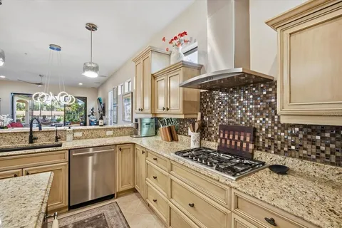 a kitchen with appliances cabinets and a sink