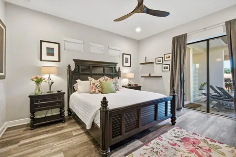 a large bedroom with bed and window
