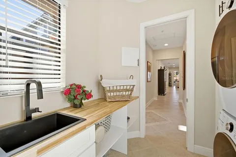 a kitchen with a sink and a refrigerator