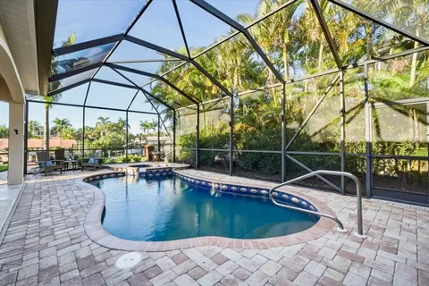 a view of a swimming pool with a patio