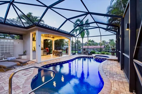 a view of a swimming pool with a patio