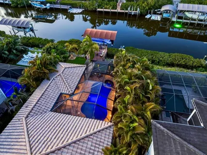 an aerial view of a house with lake view