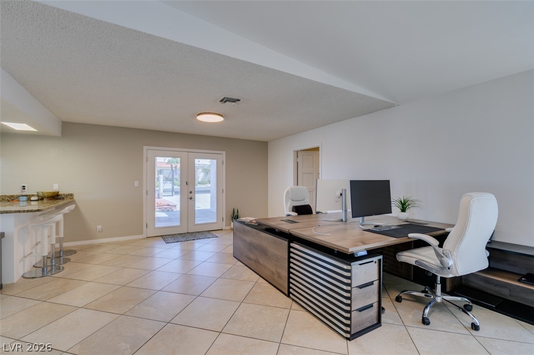 892 North Hollywood Boulevard Las Vegas, NV 89110 - Photo 32 of 81 This versatile space offers ample room for productivity and relaxation, featuring bright interiors and direct outdoor access.
