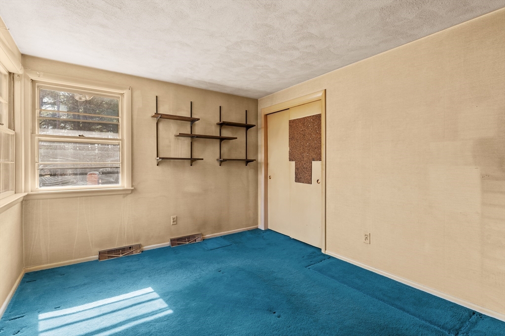 20 Joyce Road Framingham, MA 01701 - Photo 18 of 42 an empty room with wooden floor and windows