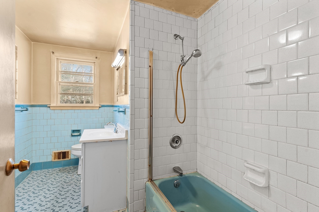 20 Joyce Road Framingham, MA 01701 - Photo 21 of 42 a bathroom with a sink a toilet and shower