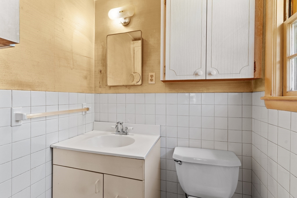 20 Joyce Road Framingham, MA 01701 - Photo 23 of 42 a bathroom with a toilet a sink and a window