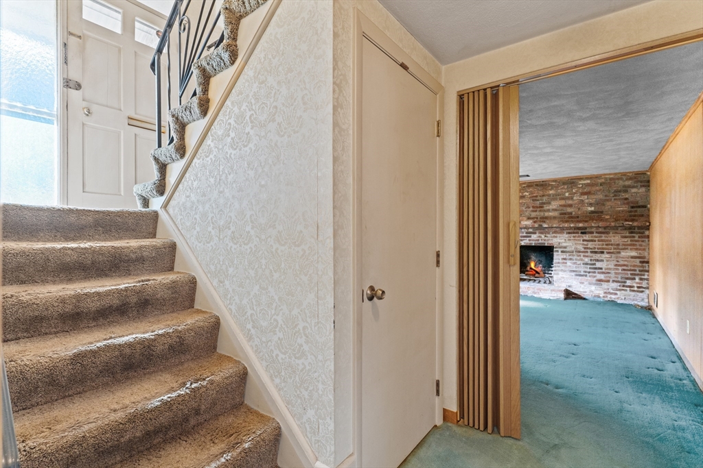 20 Joyce Road Framingham, MA 01701 - Photo 24 of 42 a view of staircase with white walls and a window