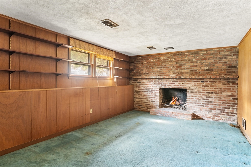 20 Joyce Road Framingham, MA 01701 - Photo 25 of 42 an empty room with a fireplace