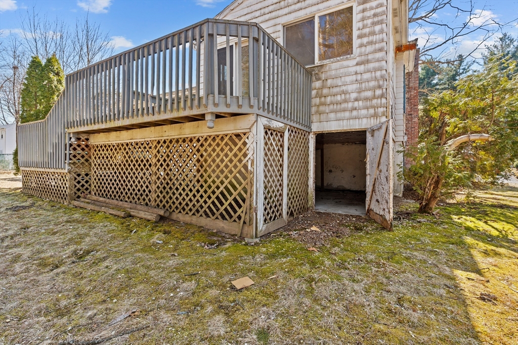 20 Joyce Road Framingham, MA 01701 - Photo 36 of 42 a view of a brick house with wooden fence