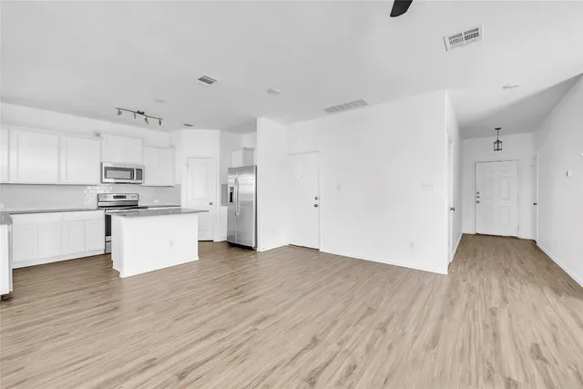 a view of kitchen with wooden floor