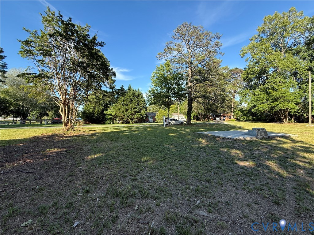 88 Seahawk Road Urbanna, VA 23175 - Photo 2 of 16 Expansive green space featuring mature trees and a
