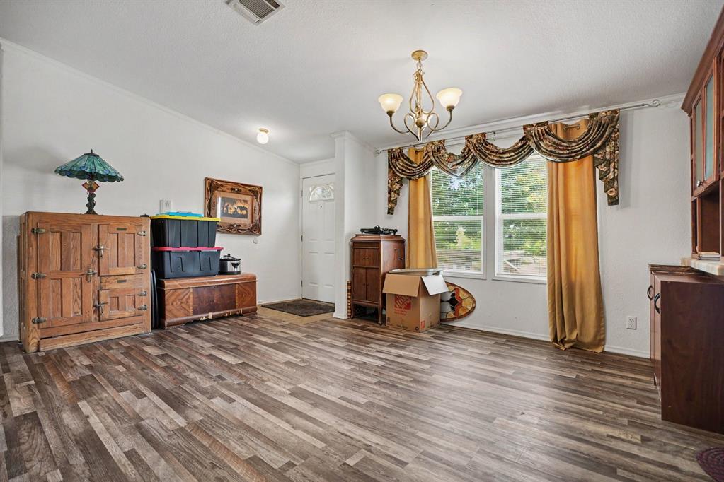 220 Barker Road Ennis, TX 75119 - Photo 6 of 30 Formal Dining area with nice laminate flooring