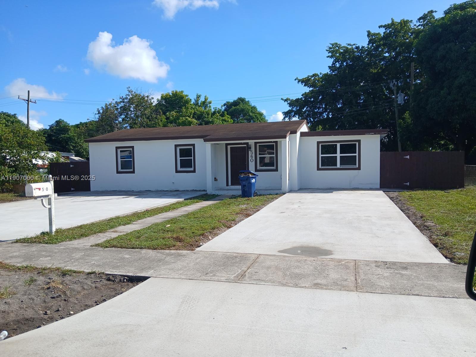 560 Northwest 188th Street, Unit 1 Miami Gardens, FL 33169 - Photo 4 of 4 a view of outdoor space yard and front view of a house