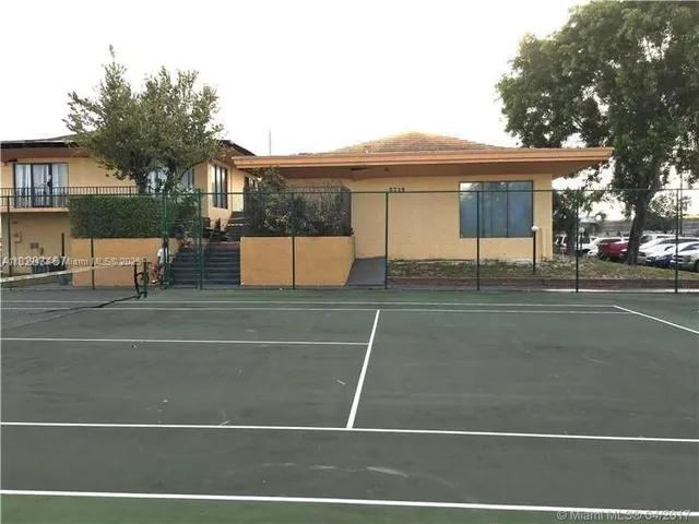 a view of swimming pool with a yard and plants