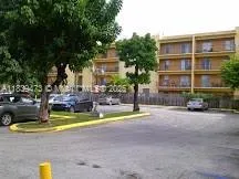 a view of street with parked cars