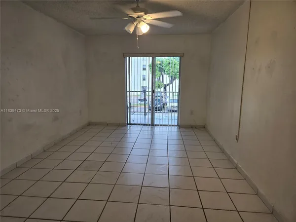 a view of an empty room and window