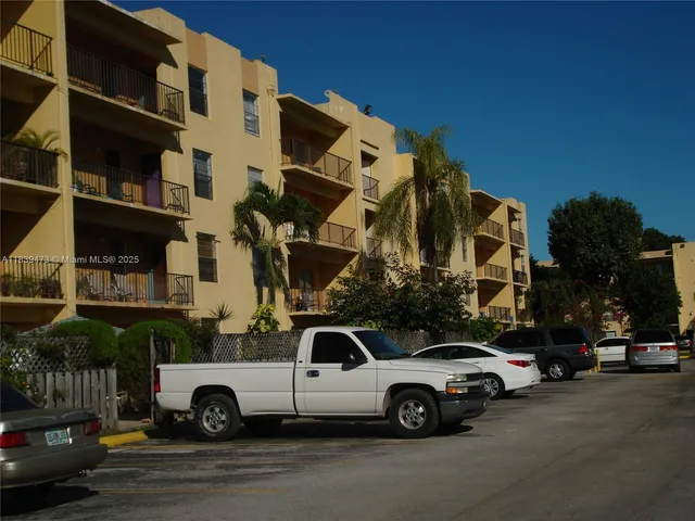 a view of street with parked cars