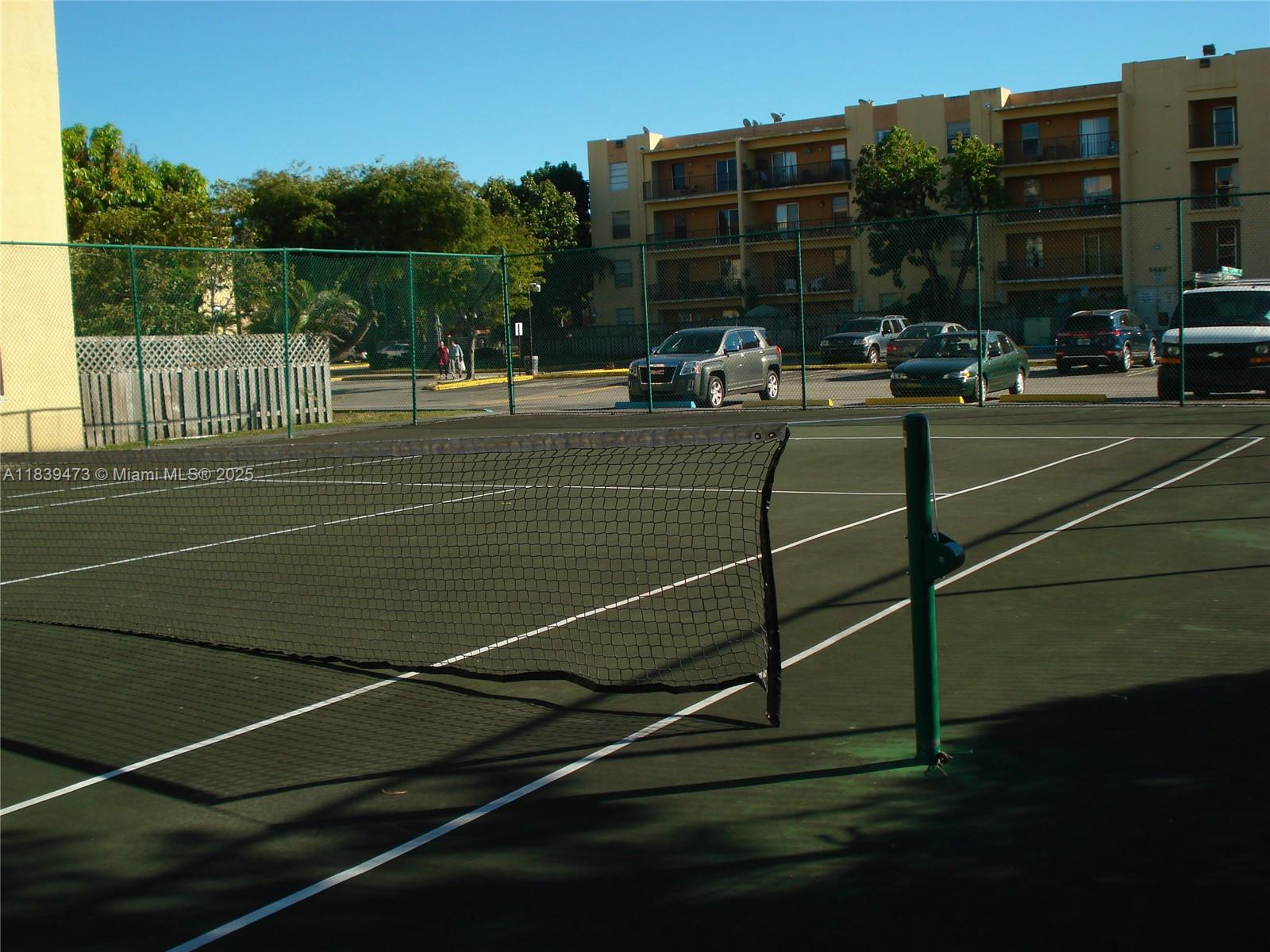 5755 West 20th Avenue, Unit 206 Hialeah, FL 33012 - Photo 23 of 23 a view of a tennis court